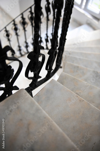 Fototapeta winding stairs with the forged rails