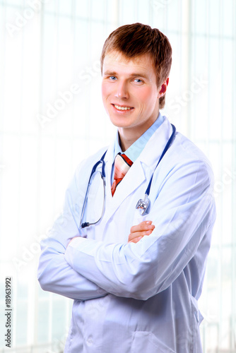 Smiling medical doctor with stethoscope