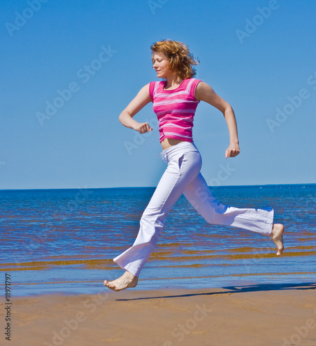 Active girl on a beach © alma_sacra