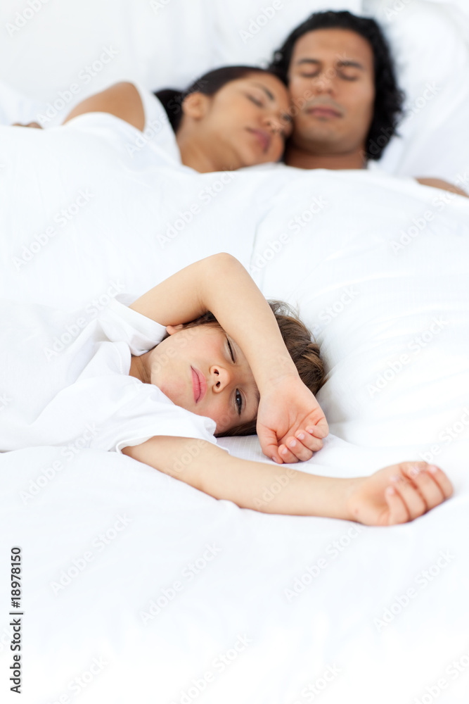 Little boy relaxing on the bed