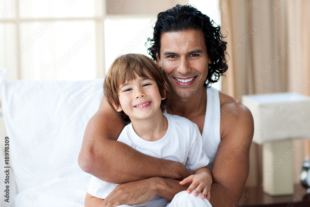 Caring father hugging his boy Caring father hugging his boy