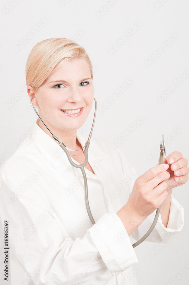 Young female doctor with medical stethoscope Young female doctor with medical stethoscope
