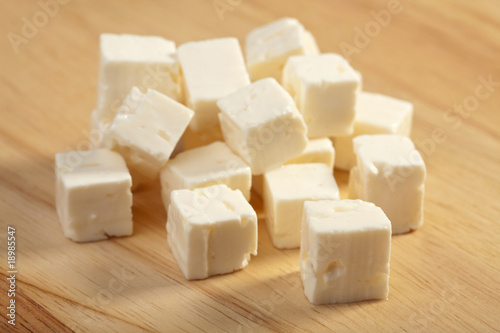 feta cheese on wooden cutting board