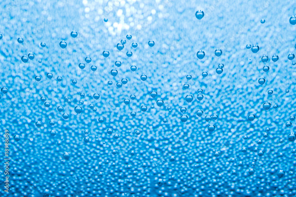 Macro of blue air bubbles in water