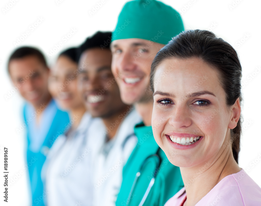 Multi-ethnic medical team smiling at the camera Multi-ethnic medical team smiling at the camera