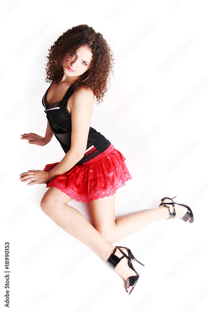 Naklejka premium Sexy girl in red skirt on white background