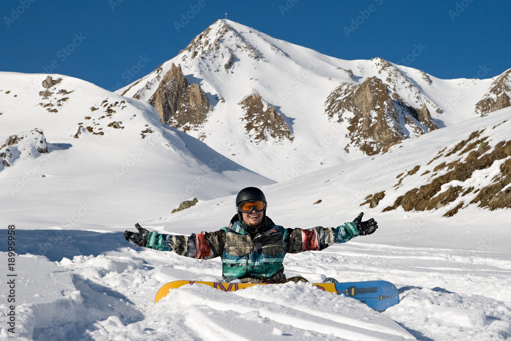 Snowboarder enjoying powder snow