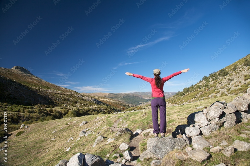open arms on stones wall open arms on stones wall