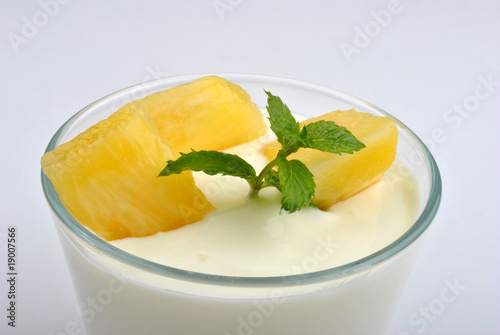 some fresh organic fruit and yoghurt in a glass