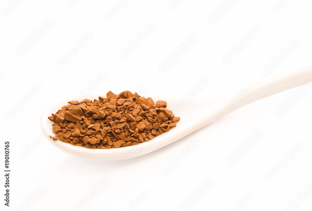 Full spoon of coffee on the white background Full spoon of coffee on the white background