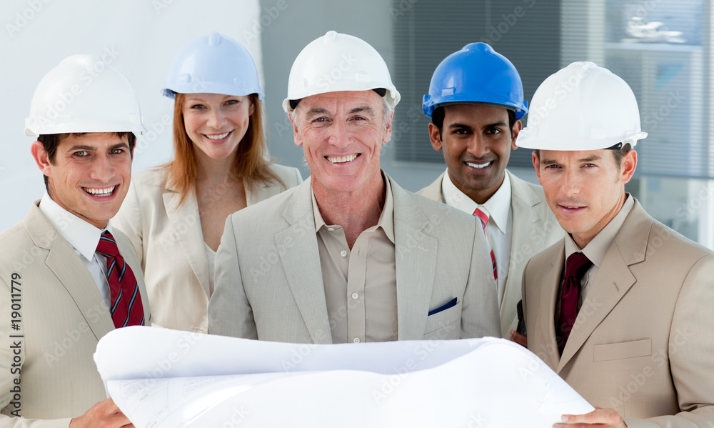 Architects with hardhats in a building site Architects with hardhats in a building site