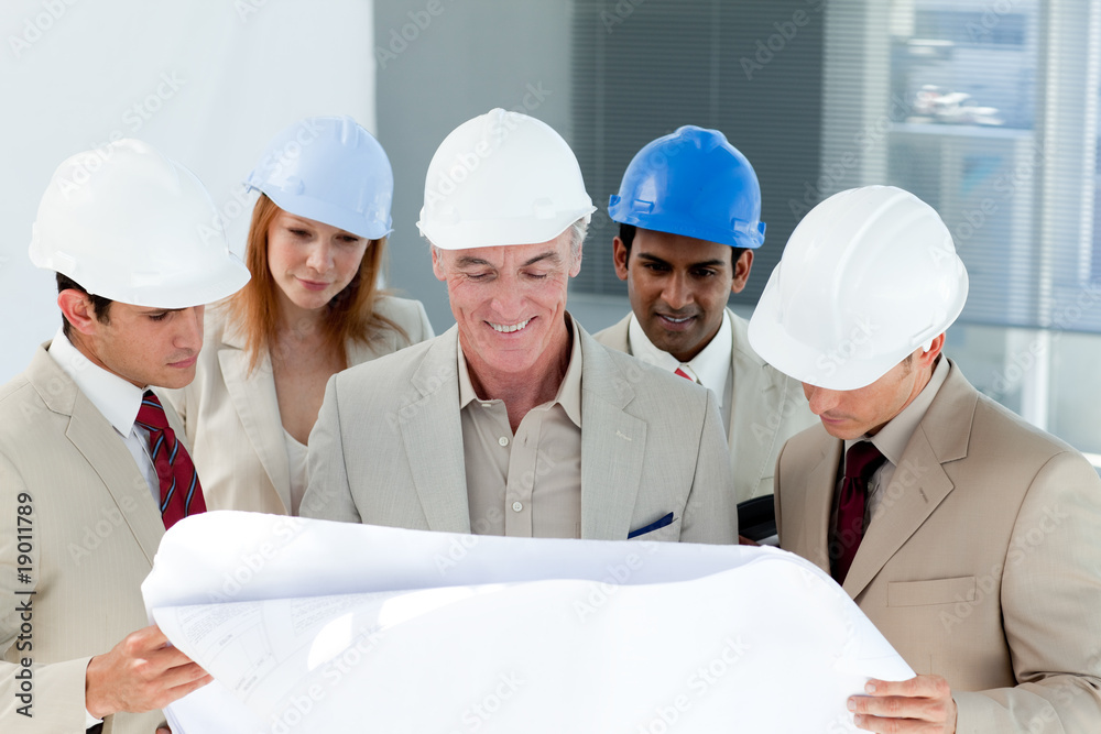 A group of architect discussing a project A group of architect discussing a project