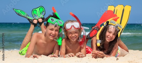 Three snorkeling kids