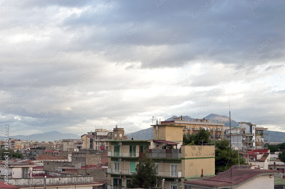 Sky and buildings in front of Vesuvius, Naples suburb, Italy