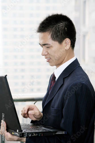 young asian businessman work with laptop in the office