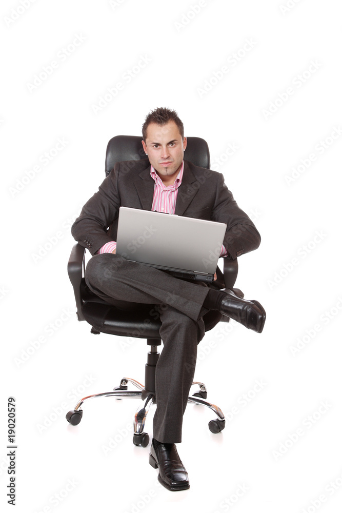Relaxed young businessman, sitting on a chair. Relaxed young businessman, sitting on a chair.