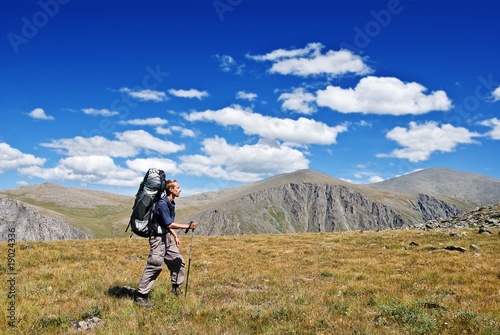 man walking in a mountains