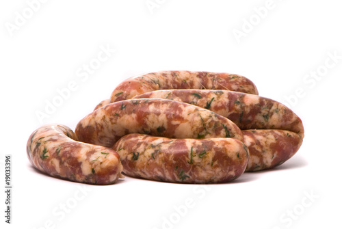 Raw sausages on white background