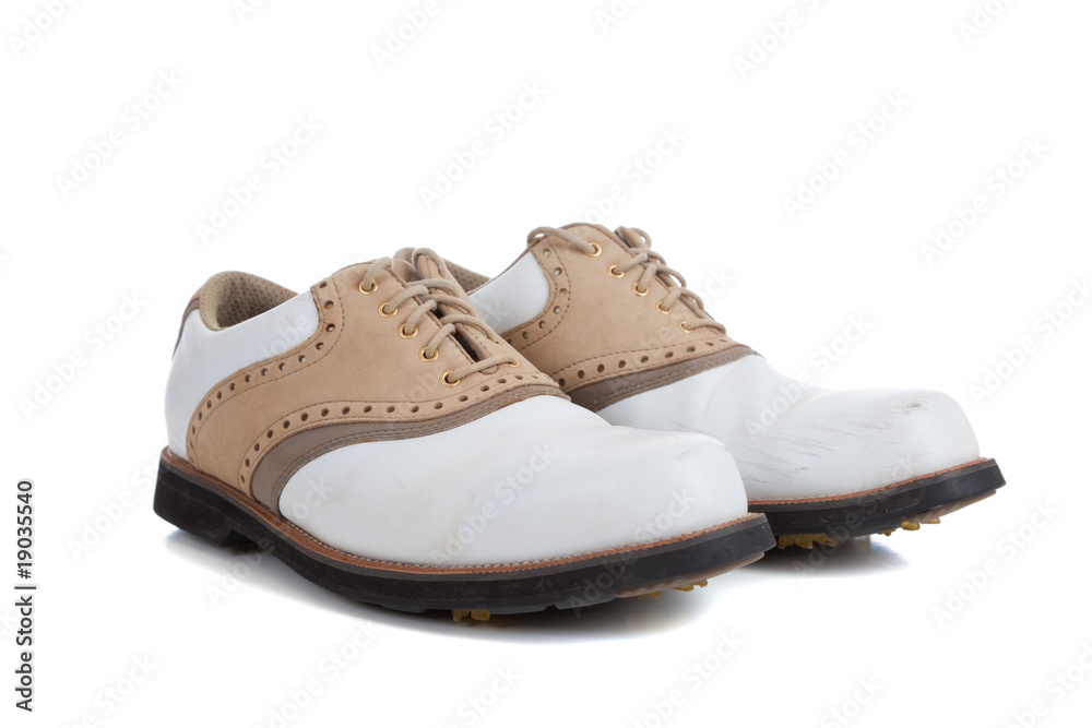 Pair of golf shoes on a white background