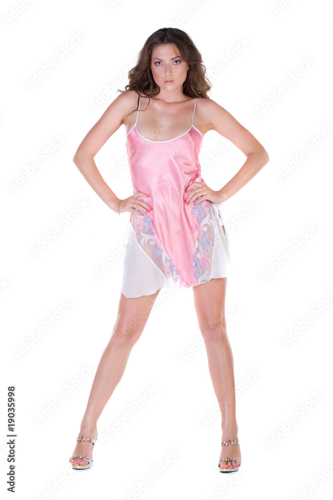 Beautiful young woman in pink nightgown