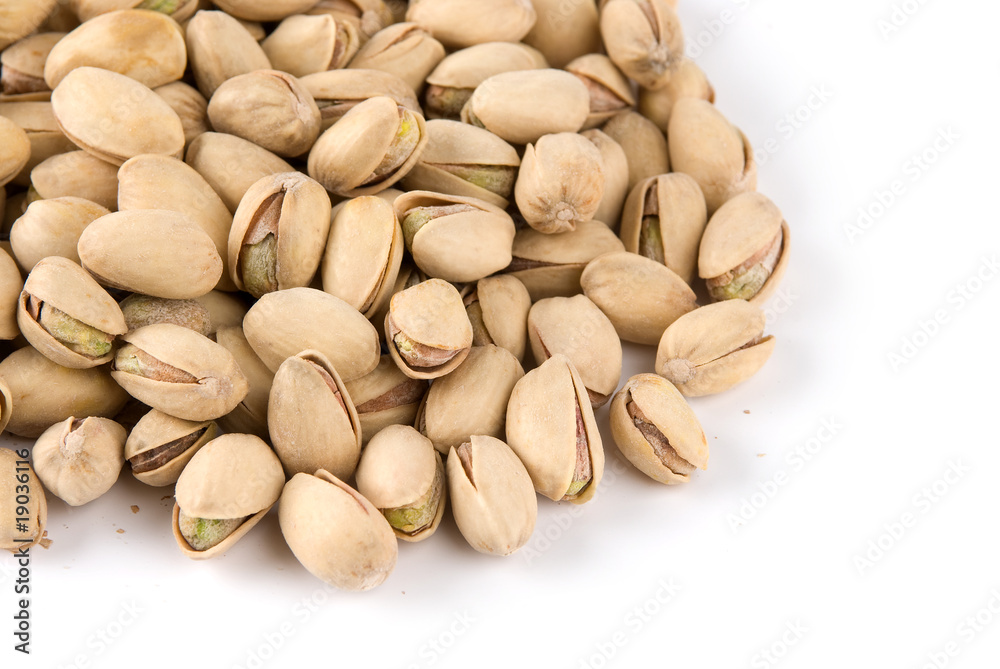 salted pistachios isolated on white background