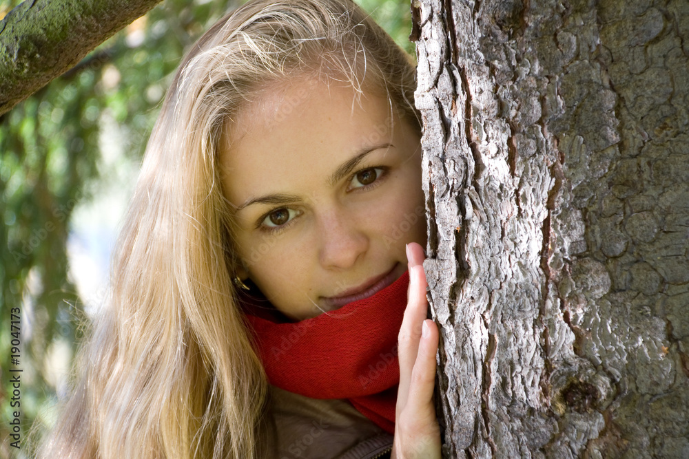 Girl Peeping out through Tree Girl Peeping out through Tree
