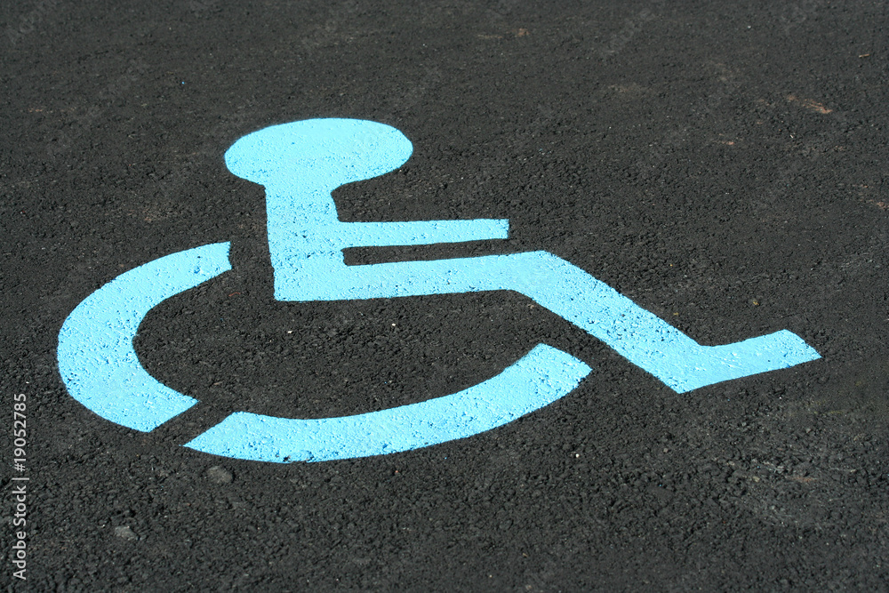 A Handicap sign painted on a parking space