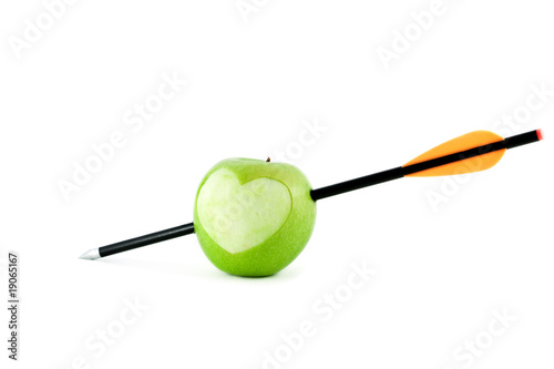 Apple with heart and arrow isolated on white