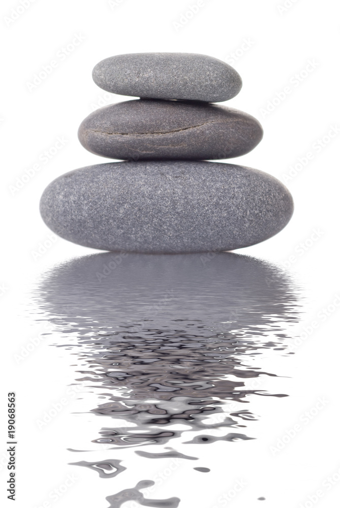 Spa stones with reflection isolated on white Spa stones with reflection isolated on white