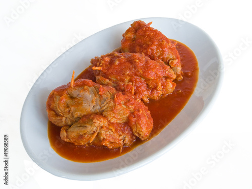 Meat roulade with tomato sauce on plate