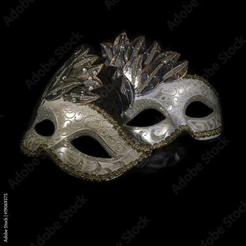 Two carnival masks on black background