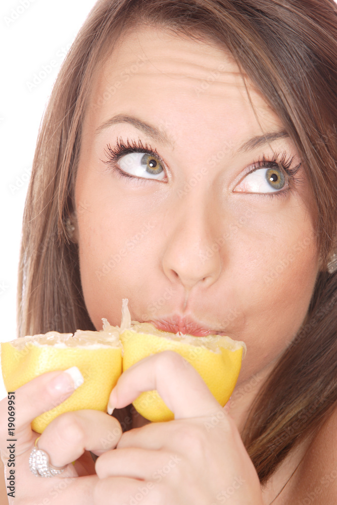 happy model eating a Lemon