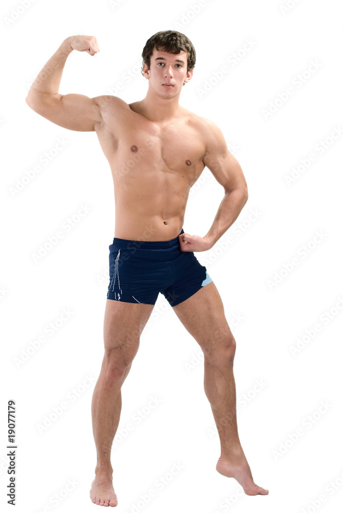Young muscular man posing isolated on white