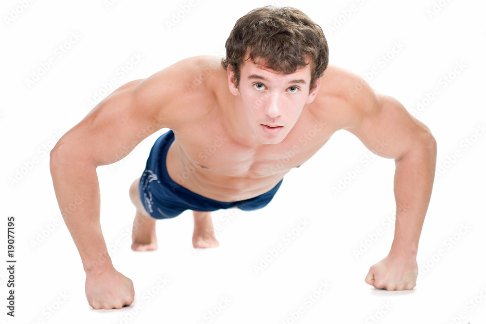 Strong man doing push-ups isolated on white. Shallow DOF. Strong man doing push-ups isolated on white. Shallow DOF.
