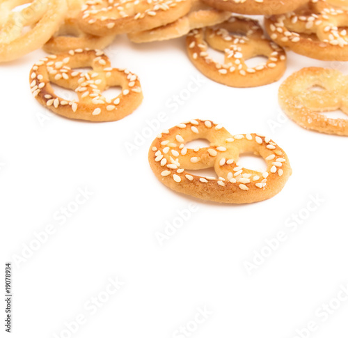 Knot-shaped biscuit with sugar and sesame