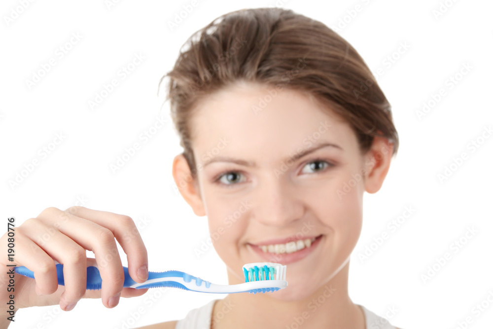 Young girl brushing her teeth happily Young girl brushing her teeth happily