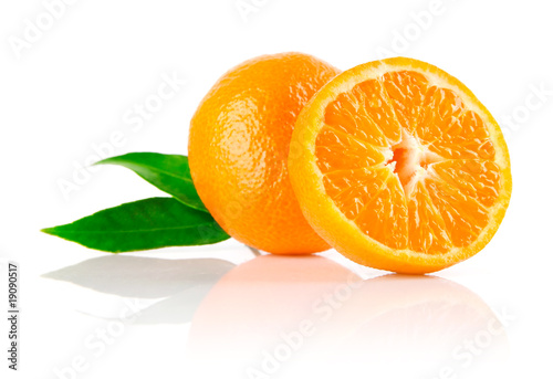 fresh mandarine fruit with cut and green leaves