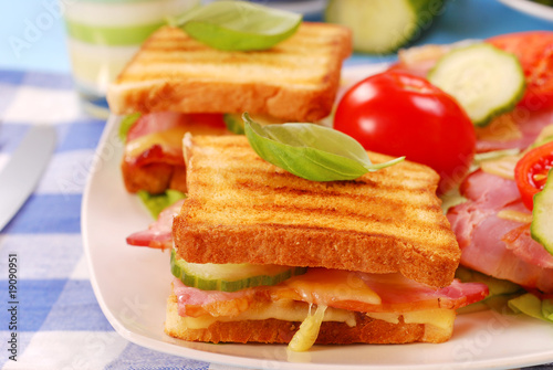 toasts with cheese,bacon and tomato