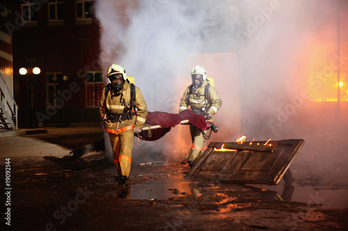 Firefighters carrying an accident victim