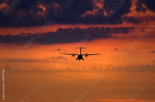 silhouette of a landing plane