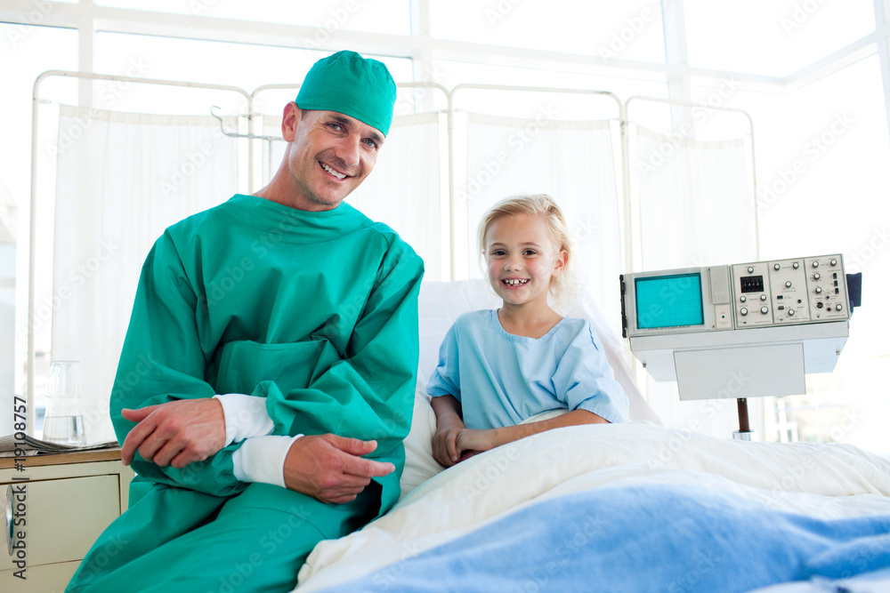 Surgeon explaining a surgery to a little girl Surgeon explaining a surgery to a little girl