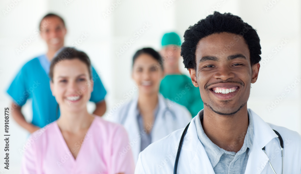 Multi-ethnic medical people smiling at the camera Multi-ethnic medical people smiling at the camera