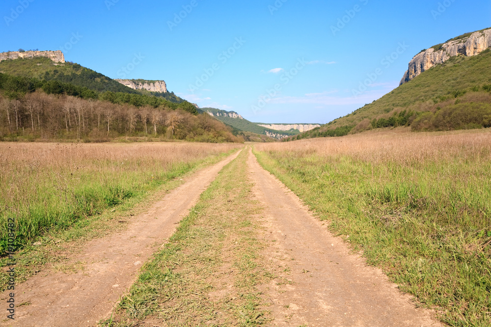 Spring Crimean mountain landscape with road in valley (Mangup Ka