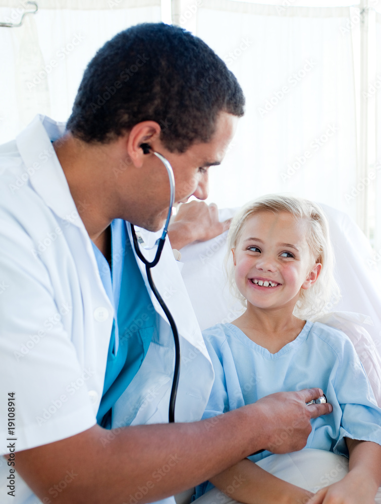 Attractive doctor checking the pulse on a young patient Attractive doctor checking the pulse on a young patient