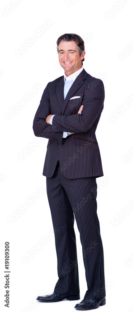 Attractive businessman with folded arms