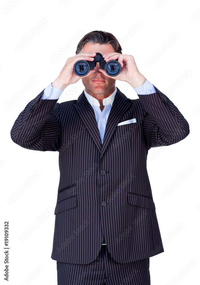 Serious businessman using binoculars Serious businessman using binoculars