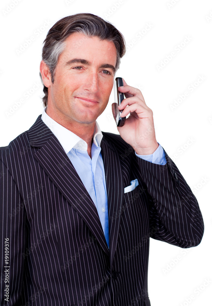 Confident businessman using a mobile phone Confident businessman using a mobile phone