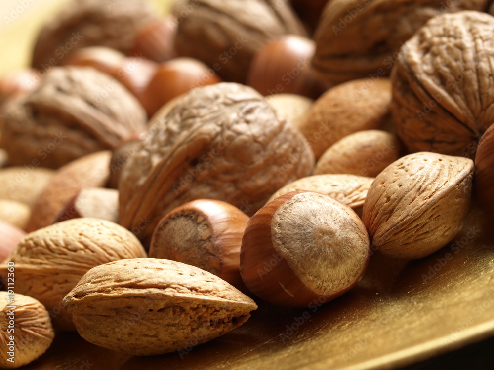 Closeup of mixed nuts: hazelnuts, walnuts, almonds. Closeup of mixed nuts: hazelnuts, walnuts, almonds.