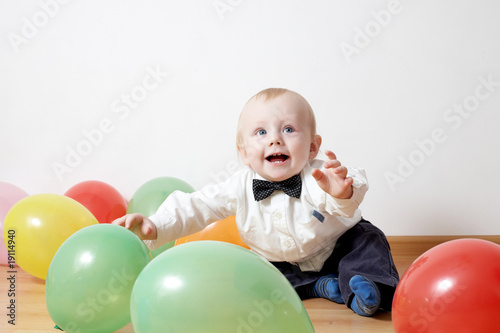 little boy with baloons