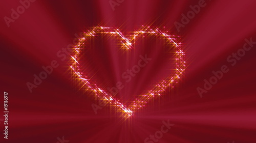 Looping heart with little sparkles and light in the background.